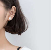 Asymmetry Bee and Daisy flower cute silver stud earrings, modeling wearing flower