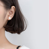 Asymmetry Bee and Daisy flower cute silver stud earrings, modeling wearing flower