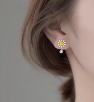 Daisy Flower Silver Stud Earrings modeling wears white daisy