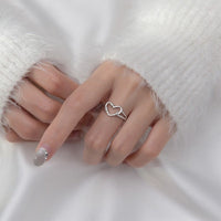 Adjustable Hands in Love Heart Ring